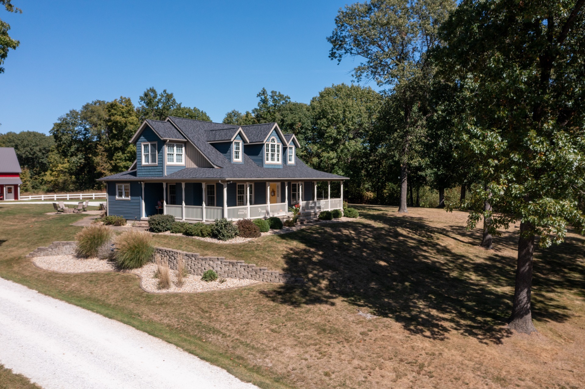 HCI residential shingle — asphalt shingle roof, cape cod style home, wrap around porch